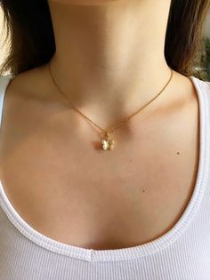 Stunning Dainty Gold Butterfly Necklace. Contains a 24k Plated gold butterfly pendant, and a gold plated chain. Great for everyday wear, special occasions, or as a gift.  ♥ Length 14" - 18" ♥ Pendant 1/2" x 3/8" ♥ Gold plated over brass ♥Matching Earrings: https://www.etsy.com/listing/853039038/24k-gold-plated-butterfly-earrings-hoop?ref=shop_home_active_11 ♥MATERIAL: -16K gold plated over brass Plated jewelry is a wonderful, affordable way to add a sophisticated look to your wardrobe, with the Elegant Gold Butterfly Charm Necklace, Dainty Gold-plated Yellow Gold Butterfly Necklace, Butterfly Necklace With Adjustable Chain For Gift, Everyday Gold Necklace With Butterfly Charm, Gold Butterfly Charm Pendant Necklace, Gold Butterfly Charm Necklace With Delicate Chain, Gold Charm Necklace With Butterfly For Everyday, Gold Butterfly Necklace With Delicate Chain, Gold Dainty Butterfly Pendant Necklace