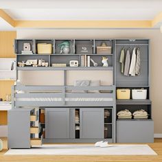 a loft bed with built in shelves and drawers