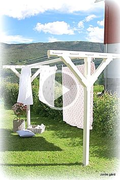 an outdoor clothes line with towels hanging from it