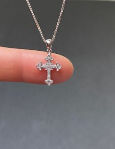 "Tiny Sterling Silver Cross CZ Necklace Minimalist and Dainty Metal: All components are made from solid .925 Sterling Silver Stone: Cubic Zirconia Measurement: pendant height is 21mm (0.83\") and 12mm (0.47\") wide Choose Chain Length At Checkout You can find other cross jewelry in my shop here https://www.etsy.com/shop/LinksAndStones?ref=seller-platform-mcnav&section_id=24376960 Please feel free to Convo me with any questions before purchasing. Please view policy before purchasing Thank You Silver Sterling Silver Cross Necklace With Diamond Cut, Sterling Silver Diamond Cut Silver Cross Necklace, Classic Diamond White Cross Necklace For Gifts, Diamond White Sterling Silver Cross Necklace For Gift, Classic Cubic Zirconia Cross Necklace For Gift, Gift Diamond White Sterling Silver Cross Necklace, Classic Cubic Zirconia Cross Necklace As Gift, Diamond White Sterling Silver Cross Necklace As Gift, Tiny Cross Necklace