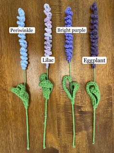 four crocheted flowers are shown in different colors and sizes, with the words periwinkle, bright purple, eggplant, lilac