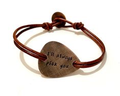 "Make the perfect personalized gift for the musician or music lover in your life. Hand stamped inspirational bracelet that carries messages, words, symbols, quotes and sayings to inspire, motivate and encourage the wearer. Metal - Copper Guitar Pick - The size and shape is of a standard guitar pick hand cut with my saw from 18ga metal sheet. Engraving - Hand stamped with up to 30 characters on each side. Leather - Double 2.2mm genuine leather with button clasp. Finish - Oxidized. Size - To find Engraved Adjustable Jewelry For Birthday Gift, Adjustable Bracelets For Father's Day Gift, Adjustable Bracelets As Father's Day Gift, Music-themed Bracelet Jewelry Gift, Adjustable Hand-stamped Bracelet For Valentine's Day, Adjustable Hand Stamped Bracelet For Valentine's Day, Hand Stamped Brown Jewelry As A Gift, Hand Stamped Brown Jewelry For Gifts, Valentine's Day Adjustable Hand Stamped Bracelets