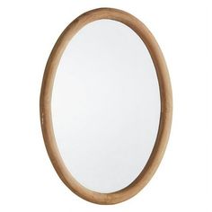 an oval wooden mirror on a white background