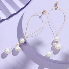 Introducing the COCOKIM Flowing Bead Series Multi-Bead Design Earrings, a fusion of elegance and craftsmanship. These earrings feature imported 14K gold-filled elements from the USA, adorned with freshwater pearls and delicately crafted with Japanese gold thread. The multi-bead design creates a captivating visual appeal. Metal: 14K Gold Filled Pearl: Freshwater Pearls Japanese Gold Thread Total Length: 8.5cm (Adjustable) Gold Threads, Pearl Drop Earrings, Bead Designs, Freshwater Pearls, Gold Filled, Pearl Earrings, Drop Earrings, Beads, Gold