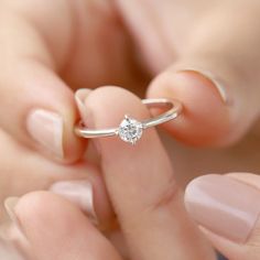 Our Tiny Kristian Moissanite Ring is the perfect stacking ring to add to your collection! It's perfect for everyday wear. Wear it by itself for a minimal look, or stack it with your other favorites. Details: Center stone Gemstone: Moissanite Stone Shape: Round Measurements: 4.00mm Band measurements: approx. 1.8mm wide, approx. 1.5mm thick The Kristian ring is also available in solid gold. Contact us for pricing. The Kristian ring is also available in other gemstones. Planet Ring, Moss Agate Ring, Minimal Look, Rose Quartz Ring, Agate Ring, Swiss Blue Topaz, Quartz Ring, Moissanite Ring, Moissanite Rings