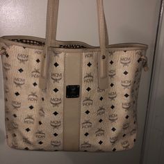 Beige Mcm Tote Bag In Good Condition , Only Sitting In Dust Bag . Not Being Used . Daily Use Monogram Canvas Bag With Double Handle, Designer Beige Bag For Errands, Monogram Canvas Pouch Bag With Handles, Double Handle Monogram Canvas Bag With Removable Pouch, Daily Use Double Handle Monogram Canvas Bag, Designer Tan Bag With Handle Drop, Monogram Canvas Bag With Double Handle For Daily Use, Monogram Canvas Bag With Handles For Errands, Designer Tan Bag