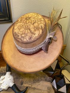 Size M vegan suede bolo hat with hand burned florals on top of crown and complete under brim,  with distressed edges. Finished with a handmade triple ribbon band in olive, gray, and rust, complete with a silver star concho and feather/grass bundle. Cowboy Hat Crafts, Custom Made Hats, Hand Burn, Wide Brimmed, Silver Stars, Cowboy Hats, Caps Hats, Accessories Hats, Cowboy