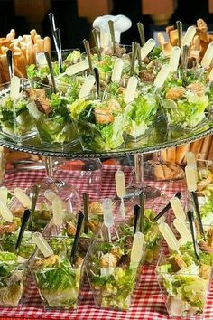 an assortment of salads and appetizers displayed on three tiered trays