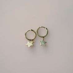 Unlock the celestial magic and let your style shine ✨ Embrace the cosmic energy and let these earrings inspire wonder and connection to the universe.💫 Check what's cool about it 😎 🌙 Crescent moon, starfish, and star charms✨ 18K gold vermeil over sterling silver💫 Secure and comfortable huggie hoops⭐ Unisex design🎁 Charming packaging Something you must know... 👀 As part of our commitment to sustainable fashion and fair trade practices, we responsibly source our materials, focusing on hypoallergenic 18k gold vermeil and .925 sterling silver. 14k Gold Filled Earrings With Star Charm As Gift, Celestial Style Yellow Gold Plated Hoop Earrings, Celestial Style Gold-plated Yellow Gold Hoop Earrings, Celestial Hypoallergenic Earrings For Everyday, Hypoallergenic Celestial Earrings For Everyday, Celestial Adjustable Hoop Earrings, Adjustable Celestial Hoop Earrings, Celestial Sterling Silver Hoop Earrings With Star Charm, Sterling Silver Celestial Hoop Earrings With Star Charm