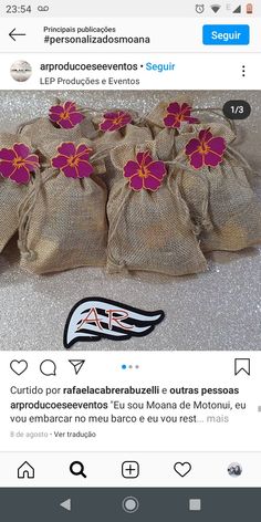 a bag filled with pink flowers sitting on top of a table