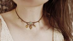 "✨ An absolute eye-catcher for your summer outfit - the macramé choker \"«Saira» adorned with brass pendants and an asymmetrical gemstone (Burma Jade). The necklace reminds me of my trip through Asia, which definitely made me a better, happier person. The name \"Saira\" has sources in many different countries. In Hindi it means \"the traveller\" and in Arabic \"cheerfulness\" / \"happiness\". All three terms are very fitting, so the naming was very easy for me. ✨  \" Material \"  waxed polyester Brass Jewelry For Festivals, Resizable Choker Necklace For Festivals, Spiritual Adjustable Necklace For Festivals, Bohemian Festival Jewelry With Adjustable Cord, Hippie Style Necklace With Adjustable Length For Festivals, Bohemian Jewelry With Adjustable Length For Festivals, Adjustable Bohemian Choker Jewelry, Festival Adjustable Choker Necklace, Unique Resizable Jewelry For Festivals