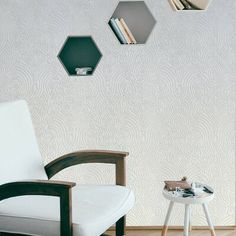 a chair and table in front of a wall with hexagons