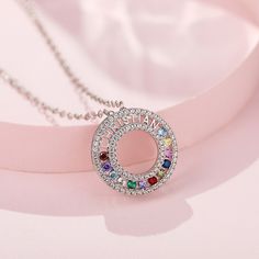 If you are looking for the perfect personalized gift, this customized round necklace will surely satisfy you. This delicate personalized necklace has 12 stones. The simple circular design and colorful stones make this necklace simple and not monotonous. Add a name of your loved one, or any message as a base engraving for that treasured personal touch.Chain Type: Weight: 2.1 gWidth: 17.8 mmMaterial: Plating Color: Silver Engagement Rings Matching, Jeulia Jewelry, Rings Matching, Rings For Couples, 12 Stones, Colorful Stones, Strong Mind, Round Necklace, Mind Quotes