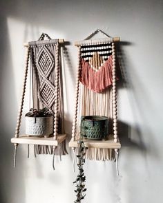 two wall hangings made out of macrame and rope with pots on them