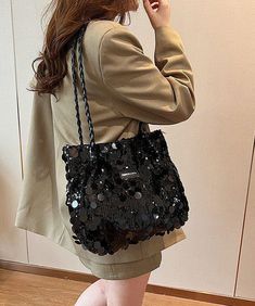 This exquisite satchel handbag boasts a generous capacity, adorned with silver sequins for a touch of sophistication.This bag is made of fine Polyester fabric.Measurement: 24cm/9.36" * 30cm/11.7" * 9cm/3.51"Zip up closure. Inside pockets. Fashion Shoes Flats, Skirt Jumpsuit, Satchel Handbag, Tunic Styles, Dress Jewelry, Satchel Handbags, Silver Sequin, Skirt Leggings, Cami Dress