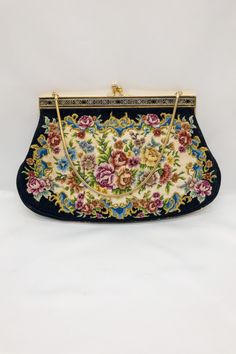 ❁ Stunning Vintage (around 1940's ) Tapestry (carpet) Handbag or Evening Bag. ❁ It is a tapestry style bag with a "snake" chain handle - and a gold-tone clasp closure, as photographed.  ❁ Beautiful vintage roses floral tapestry embroidered needlepoint evening bag same pattern both sides and pattern around trim brass frame has texture pattern to it ❁ Measurements taken at widest points  25 cm. x 16 cm. ❁ In excellent condition inside and out,  A lovely example - which looks like it has been store Vintage Tapestry Bag For Evening, Vintage Evening Bag In Tapestry Material, Vintage Embroidered Rectangular Clutch, Gold Tapestry Rectangular Bag, Formal Embroidered Tapestry Bag, Antique Tapestry Evening Bag, Evening Tapestry Rectangular Shoulder Bag, Handmade Tapestry Evening Bags, Evening Rectangular Tapestry Shoulder Bag