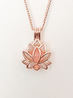 Beautiful Lotus Flower necklace with Rose Quartz tucked inside.  Gold. 18"+2 chain. Or Rose Gold (Zinc alloy) Rose Quartz Healing Properties ♥ Unconditional love ♥ Self-love ♥ Mother love ♥ Caring ♥ Kindness ♥ Friendship ♥ Romantic love ♥ Platonic love Check out all of our other items while you are here! Personalized Jewelry - Necklaces, bracelets, key chains, charms & more! Welcome to Real Cool Treasures where you will find high quality personalized jewelry, Floating lockets, and much more, all Adjustable Rose Gold Necklaces With Rose Design, Adjustable Rose Gold Necklace With Rose Design, Rose Gold Flower Pendant Necklace Gift, Rose Gold Pendant Flower Necklace For Mother's Day, Rose Gold Flower Shaped Jewelry With Adjustable Chain, Rose Gold Flower Necklace With Adjustable Chain, Rose Gold Flower Pendant Necklace For Mother's Day, Pink Locket Jewelry For Mother's Day, Adjustable Rose Gold Flower Pendant Necklace