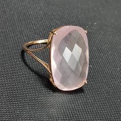 This stunning ring is set in 14k Solid Yellow Gold with Natural Rose Quartz with utmost precision. It is a unique statement gemstone ring for nearly every occasion and is completely hassle-free jewelry. ITEM DETAILS: *  GEM: Rose Quartz * GEM SIZE: 20X12mm * GEM SHAPE: Rectangle Cushion * Total Gem weight: 9.65 carats * Gold Purity: 14KT  * Gold Weight: 1.54 gram * Total Weight of the Ring: 3.47 gram The Gold purity is guaranteed and it comes with an authentic 14KT gold hallmark. Since my items Elegant Ring With Faceted Rectangular Stone, Luxury Rectangular Pink Rings, Luxury Pink Rectangular Rings, Elegant Rose Gold Jewelry With Rectangular Stone, Formal Rings With Faceted Rectangular Stone, Elegant Morganite Ring With Gemstone Accents, Elegant Rectangular Gemstones For Anniversary, Rose Gold Faceted Fine Jewelry Rings, Elegant Rectangular Gemstones For Formal Occasions