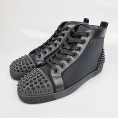 Designer High-top Sneakers With Perforations For Streetwear, Designer High-top Sneakers With Round Toe For Sports, Designer Round Toe High-top Sneakers For Sports, Designer Synthetic Sneakers For Streetwear, Designer High-top Sneakers With Perforations, Designer High-top Sneakers With Red Sole For Streetwear, Designer Black High-top Sneakers With Studded Outsoles, Modern High-top Sneakers With Studded Outsoles And Round Toe, Modern Round Toe High-top Sneakers With Studded Outsoles