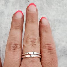 This dainty and charming ring is hand-crafted from high-quality sterling silver, ensuring both durability and style. Choose your favorite initial to be hand stamped on the ring, making it a delightful and meaningful gift for yourself or someone special. With meticulous precision, we create a unique design that adds a playful flair to the ring's overall allure. Express your individuality and show off your style by stacking this fabulous Sterling Silver Initial Ring with other favorites. Whether y Silver Initial Ring, Ring Making, Velvet Ring Box, Sterling Silver Initial, Initial Ring, Tiny Heart, Stamped Jewelry, Stacking Ring, Ring Box