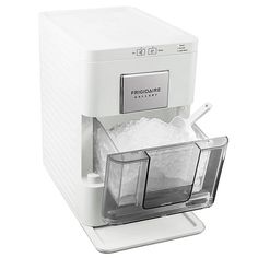 a machine that is sitting on top of a white surface with ice in front of it