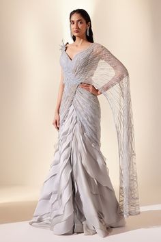 Powder blue draped padded saree gown with leaf embellishment, metallic lush embroidery. - Aza Fashions Latest Wedding Outfits For Women, Outfits For Events Classy, Trending Indo Western Outfits, Trending Gown Designs, Designer Party Wear Dresses Classy, Drape Saree Designer, Haldi Carnival, Saree Couture, Draped Saree Gown