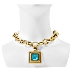 Vintage Givenchy Gold Tone Heavy Link Chain with Dangling Blue Drop Necklace. A classic look from Givenchy. Heavy square blue, clear faceted piece hangs from large oval links. A lot of appeal here. 16" -20" L x .75" W. The drop is 2.25" L x 1.5" W. French Modern, Vintage Givenchy, Drop Necklace, Link Necklace, Link Chain, Classic Looks, Givenchy, Gold Tones, Jewelry Necklaces