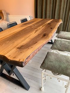 a large wooden table sitting in the middle of a room