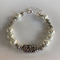 Hand Crafted Pearls & Silver Scroll Bead Bracelet By Desert Beads, 7" Adjustable Stunning Tibetan Silver Filigree Bead Gives A Beautiful Feminine Touch Along With The White Pearls And Several Smaller Silver Beads. This Is A Gorgeous Piece That Can Be Worn Any Time, Any Place. Perfect For Bride, Bridesmaid, Or Mother Of The Bride. The Bracelet Is Finished With A Lobster Claw Closure. Strung On High Quality Jewelry Wire, It Has An Adjustable Chain. I Can Lengthen The Chain For You Or Remove The Ch Elegant White Beaded Crystal Bracelet, White Pearl Beaded Bracelets With 8mm Beads, Elegant White Beaded Bracelets With 8mm Beads, Elegant White Crystal Bracelet With Spacer Beads, Elegant Large Beads Bracelets For Party, Elegant White Bracelets With 8mm Beads, Elegant Large Beads Bracelet For Party, Elegant Party Bracelets With Large Beads, Elegant Large Beaded Bracelets For Party