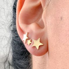 "This precious earring is composed completely of 14K solid gold and comes with matching 14K solid gold secure earring backs. This earring is thick enough for a single initial to be engraved. NOTE: If you wish to customize this item with engraving font please indicate the specific font style desired in the 'Note to Seller' section upon checkout. ♦ Star Dimensions: approximately 8mm (w) x 8mm (h) ♦ Post Thickness: 20 gauge (0.8mm) ♦ Metal Finish: High Shine Polish ♦ This design is available in Ros Gold Nickel-free Star Cartilage Earrings, Gold Star Cartilage Earrings In Minimalist Style, Gold Star Cartilage Earrings Nickel Free, Gold Star Cartilage Earrings, Gold Star Shaped Pierced Cartilage Earrings, Gold Star Cartilage Earrings Minimalist Style, Gold Star Cartilage Earrings For Pierced Ears, Gold Piercings With Star Charm As Gift, Gold Star-shaped Dainty Cartilage Earrings