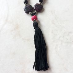 This handmade necklace and earring set is made from a handmade black thread tassel; semiprecious black onyx and pink and black Turkey turquoise; black and hot pink glass beads and seed beads; and silver-tone components. Handmade Black Onyx Beads, Black Beaded Necklaces With Colorful Beads For Spiritual Use, Black Beaded Necklace With Dangling Beads As Gift, Black Bohemian Beads For Festivals, Black Spiritual Beaded Necklace With Colorful Beads, Spiritual Black Beaded Necklaces With Colorful Beads, Spiritual Black Beaded Necklace With Colorful Beads, Black Adjustable Bohemian Beaded Necklaces, Black Bohemian Beaded Necklace