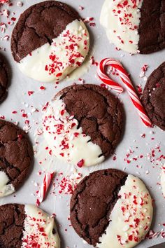 chocolate cookies with white frosting and candy canes