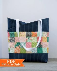 a tote bag made out of patchwork fabric with the words pdf pattern only on it