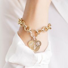 14K Yellow Round Link Charm Bracelet This Round Link Charm Bracelet is perfect for building your own heirloom bracelet. Order by itself or with charms that represent your special milestones and loved ones. Pairs perfectly with our Medium and Large Charms, as well as our Medallions! Pair with any of our loose charms and we will assemble them in-house for you! We recommend sizes medium or large, or get creative and choose one of our Falling Letter Pendants or Enamel Medallions. Product Details Link Size: 11.6 mm Weight: 7.5 inches (Solid Gold) is 9 grams (without any charms) Features a push in lock clasp Available in 14K Yellow Gold Not sure what size to order? Check out our Bracelet Sizing Guide! Comes in gift box Ships in 2 weeks (if ordered plain), 4 weeks if ordered with charms Additiona Customizable 14k Gold Bracelet Jewelry, Customizable 14k Gold Bracelet, Elegant Yellow Gold Charm Bracelet With Removable Charms, Personalized 14k Gold Charm Bracelet For Anniversary, Yellow Gold Bangle Charm Bracelet For Anniversary, Elegant Charm Bracelet With Initials For Anniversary, Elegant Charms Bracelets For Anniversary, Elegant Charm Bracelets For Anniversary, Elegant Initials Charm Bracelet For Anniversary