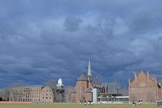 a large building with a clock tower in the background