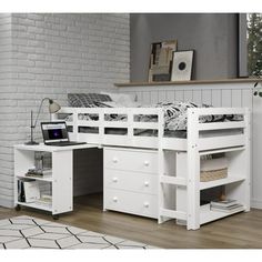 a white loft bed with drawers underneath it and a laptop on the desk next to it