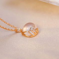 ✦ Looking for a unique and stylish piece of jewelry? Look no further than this Pink Pendant Necklace featuring a natural Rose Quartz stone and delicate Leaf Design. The necklace is crafted from high-quality 925 silver with a gold vermeil finish, which gives it a luxurious look and feel. The Leaf Design pendant is inspired by nature, and the natural pink Rose Quartz stone adds a touch of femininity to the piece. The pendant is suspended from a delicate chain that is adjustable, so you can wear it Rose Gold Plated Necklaces For Her, Rose Gold Plated Necklaces As Gift For Her, Rose Gold Plated Necklace For Gift, Rose Gold Plated Necklace For Her, Rose Gold Plated Necklace Gift For Her, Feminine Rose Gold Necklace With Clavicle Chain, Rose Gold Round Pendant Necklace For Her, Rose Gold Round Pendant Necklace As Gift For Her, Feminine Rose Gold Necklaces With Clavicle Chain