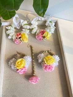 a box with flowers and pearls in it