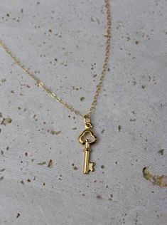 Meet Carolina, your next jewelry obsession. Its vintage key pendant is perfect for layering or wearing it by itself. MATERIALS & SIZE Material: 18k gold filled chain and 18k gold plated pedant Size: 16 in. chain Extender: 2 in. JEWELRY CARE Most of our jewelry is tarnish resistant, hypoallergenic, safe for sensitive skin. Handmade with ♡ in New York. - To maintain the beauty of your jewelry, whether it’s stainless steel, gold plated, or gold-filled, always avoid saltwater, chlorine (swimming poo Vintage Key Necklace, Key Necklace Vintage, Necklace Pendent, Vintage Key, Vintage Keys, Key Necklace, Chain Extenders, Key Pendant, Gold Filled Chain