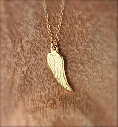 Tiny gold wing necklace - angel wing necklace - guardian angel wing - fairy wing - a gold vermeil wing charm on a 14k gold vermeil chain A super cute and tiny gold vermeil wing hanging peacefully from a 16 inch 14k gold vermeil chain. Perfect for layering! Please feel free to select a different length chain if you prefer. ♥ Need a super cute set of matching earrings? https://www.etsy.com/listing/481118655/gold-wing-earrings-tiny-wing-earrings Need an energy boost? You can also add a little tourm Sterling Silver Gold Angel Wings Jewelry, Gold Winged Sterling Silver Jewelry, Gold Sterling Silver Jewelry With Angel Wings, Gold Wing-shaped Sterling Silver Necklace, Angel Wings-shaped Jewelry As Gift, Angel Wings-shaped Jewelry For Gifts, Angel Winged Jewelry For Gifts, Angel Wings Jewelry Gift, Angelic Gold Necklaces As Gifts