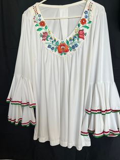 Hand painted white top / tunic Hungarian Kalocsa design  The sleeves bottom got  red-white -green hand embroidered lace Size XXL White Folk Style V-neck Blouse, Summer Tunic Top With Embroidered Sleeves, White Cotton Bell Sleeve Top, White Casual Tunic Peasant Top, Green Blouse With Embroidered Sleeves For Spring, White Folk Peasant Top For Festival, Traditional White V-neck Embroidered Top, White Tunic Blouse For Spring, White Embroidered Top With Embroidered Hem For Festival