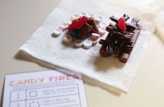 two pieces of candy sitting on top of a napkin