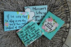 three pieces of paper on top of a wicker basket filled with flowers and words