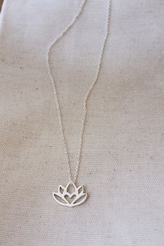 An original Lola&Cash protea necklace featuring a hidden heart -- d e t a i l s -- -protea measures 2cm wide -hand sawn out of solid sterling silver -completed in a mirror finish -includes a 45cm chain This pendant is also available in gold as seen in last picture https://www.etsy.com/listing/621948340/gold-protea-pendant-solid-9ct-yellow?ref=shop_home_active_1 -All Lola&Cash jewellery will arrive gift wrapped ---------------------------------------- Please Note - Made to order - Rush or Dainty Flower Pendant Jewelry For Meditation, Elegant Lotus Flower Jewelry Gift, Delicate Silver Necklace For Meditation, Spiritual Lotus Flower Necklaces For Gifts, Spiritual Lotus Flower Necklace Gift, Delicate Small Jewelry Gift, Delicate Jewelry For Gifts, Small Minimalist Necklace As A Gift, Delicate Silver Charm Necklaces For Bridesmaids