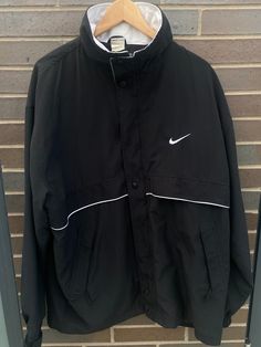 Vintage 1990s Nike Embroidered Swoosh Windbreaker Track Jacket - Size XL (Length 32", Chest 26") - Great vintage condition (no holes/no stains) - On the very rare 90s Made in USA Nike tag!! - Message for more information Please take note of the measurements listed as these are vintage clothes and may fit different than the tag size. Follow our page for more vintage clothing drops! Connect with us on Instagram: @recurarchives Nike 90s Vintage Women, Nike 90s Vintage Hoodie, Urban Crew Neck Track Jacket For Sports, Sporty Black Windbreaker For Sports Season, 90s Style Black Track Jacket For Outdoor, Sporty Crew Neck Outerwear For Sports, Sporty Crew Neck Track Jacket For Streetwear, 90s Style Sports Outerwear With Crew Neck, Sporty Black Windbreaker For College