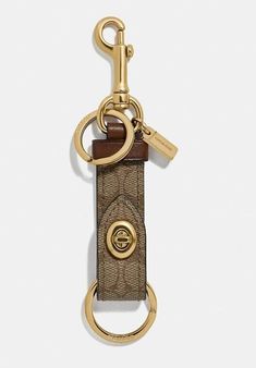 NWT COACH KHAKI SIGNATURE TRIGGER SNAP KEYCHAIN 49314 FOB KEY CHAIN BAG CLIP RETAIL PRICE $70.00 BRAND NEW WITH TAGS IN ORIGINAL PACKAGING GUNMETAL HARDWARE  Signature coated canvas and refined calf leather Turnlock closure Attached split key rings and dogleash clip 3/4" (L) x 2 1/2" (H) Style No. F49314 ALL MEASUREMENTS ARE APPROXIMATE! WE MEASURE IN THE CENTER OF THE ITEM! PLEASE EMAIL ME WITH ANY QUESTIONS PRIOR TO THE CLOSING OF BIDDING. ALL ITEMS COME FROM A SMOKE FREE ENVIRONMENT. THANKS FOR LOOKING AND GOOD LUCK. ALL ITEMS ARE GUARANTEED AUTHENTIC OR YOUR MONEY BACK Import duties, taxes, and charges are not included in the item price or shipping cost. These charges are the buyer's responsibility. Please check with your country's customs office to determine what these additional cost Snap Bag, Bag Clips, H Style, Chain Bag, Eyewear Fashion, Cute Pins, Chain Bags, Womens Uggs, Key Ring