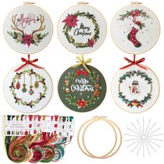 cross stitch christmas ornament kits with ribbons and ribbon hangers on white background