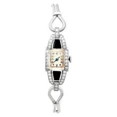 An impressive vintage Art Deco 0.95 carat diamond and black onyx, platinum cocktail watch by 'Hamilton'; part of our diverse antique jewelry and estate jewelry collections. This impressive vintage Art Deco diamond watch has been crafted in platinum. The watch has a rectangular dial with plain black Arabic hour numerals displayed within rectangular designs, the outer one marked as the chapter ring. The Art Deco watch is fitted with shaped, blued steel hands, and the face clearly displays the text Formal Black Diamond Watch With Diamond Accents, Formal Black Diamond Accented Watch, Formal Black Diamond Watch, Antique Platinum Evening Watches, Art Deco Platinum Evening Watches, Elegant Black Diamond-accented Watch, Platinum Art Deco Evening Watches, Elegant Black Diamond Accented Watch, Black Diamond Evening Watch