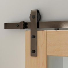 an image of a sliding door with wood and metal hardware