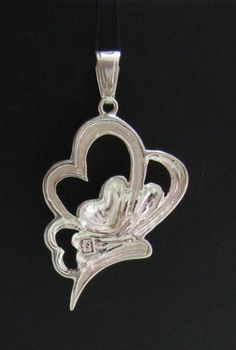 Sterling silver pendant - PE000739. Stamped 925. Approximate weight 4.2 grams. Dimensions 3.2x2.1cm (1.28x0.84 inches).All our jewels are made from solid sterling silver 925/1000 and are carefully crafted by hand in our family workshop.We dispatch your orders in 5 working days, worldwide and the postage is $5. We ship registered priority mail. Please allow 5-7 working days for delivery in Europe and 10-15 working days outside Europe.For any questions – please do not hesitate to contact me! Silver Heart-shaped Jewelry Stamped 925, Silver Heart Jewelry Stamped 925, Heart-shaped Silver Jewelry Stamped 925, Silver Double Heart Hallmarked Jewelry, Silver Hallmarked Double Heart Jewelry, Silver Pendant Jewelry For Anniversary, Silver Heart Pendant Jewelry Stamped 925, Sterling Silver Open Heart Jewelry, White Gold Heart Pendant Stamped 925